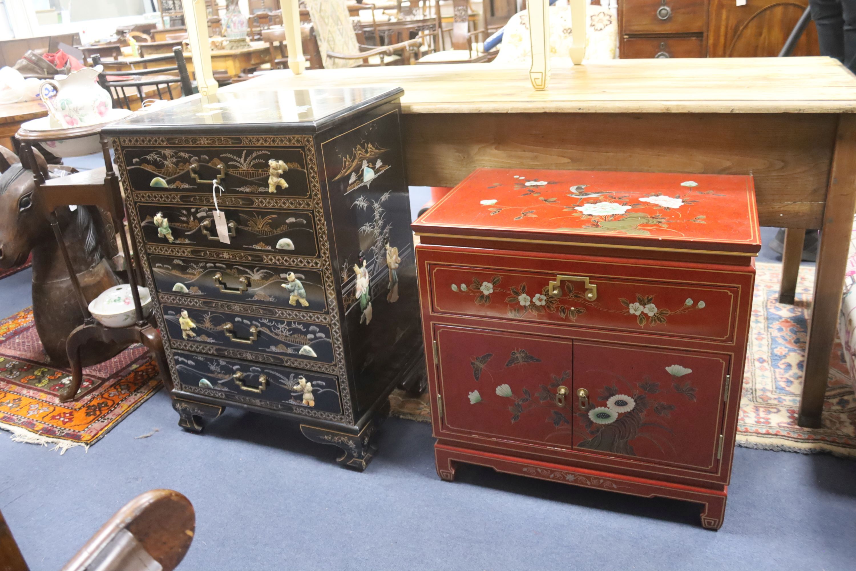 A Chinese black laquer chest of five drawers, a red lacquer chest and a cream lacquer coffee table